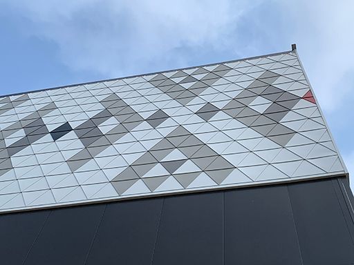 The roof of a building with a geometric pattern on it.