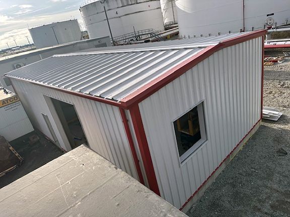 Top view of metal building at Vancouver Airport used for storage and as workshop.