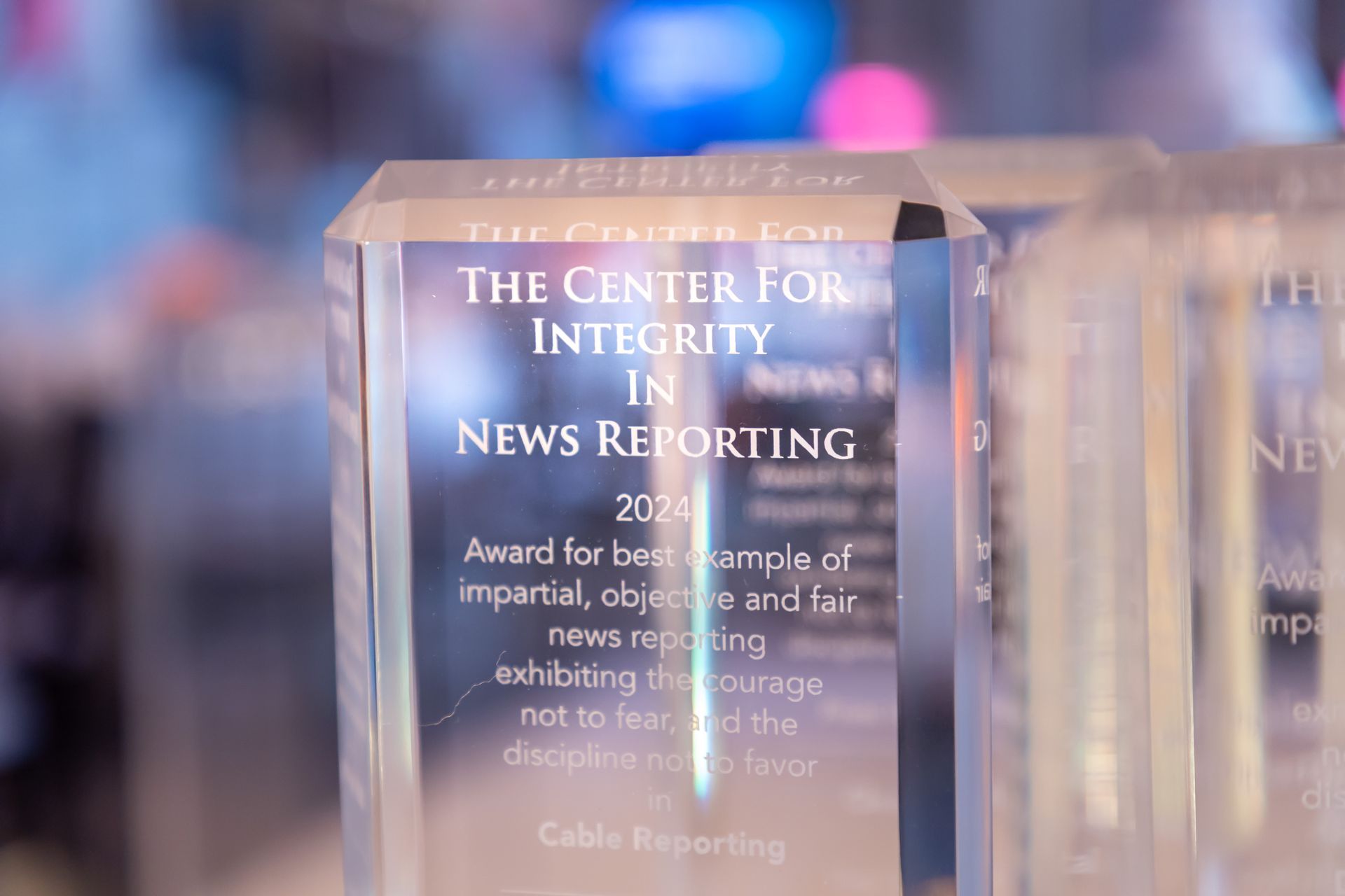 An acrylic award sitting on a table