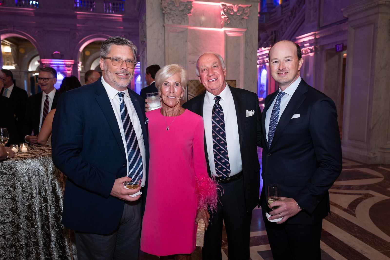 A group of people are posing for a picture at a party.