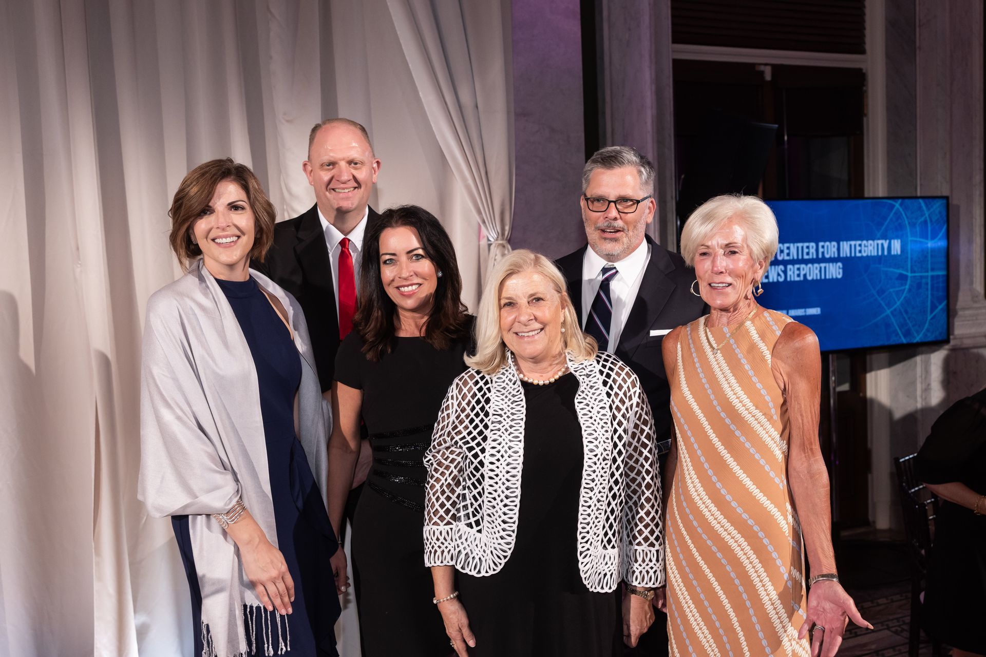 A group of people are posing for a picture together.