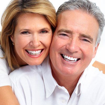 Middle age couple who have had dental implants