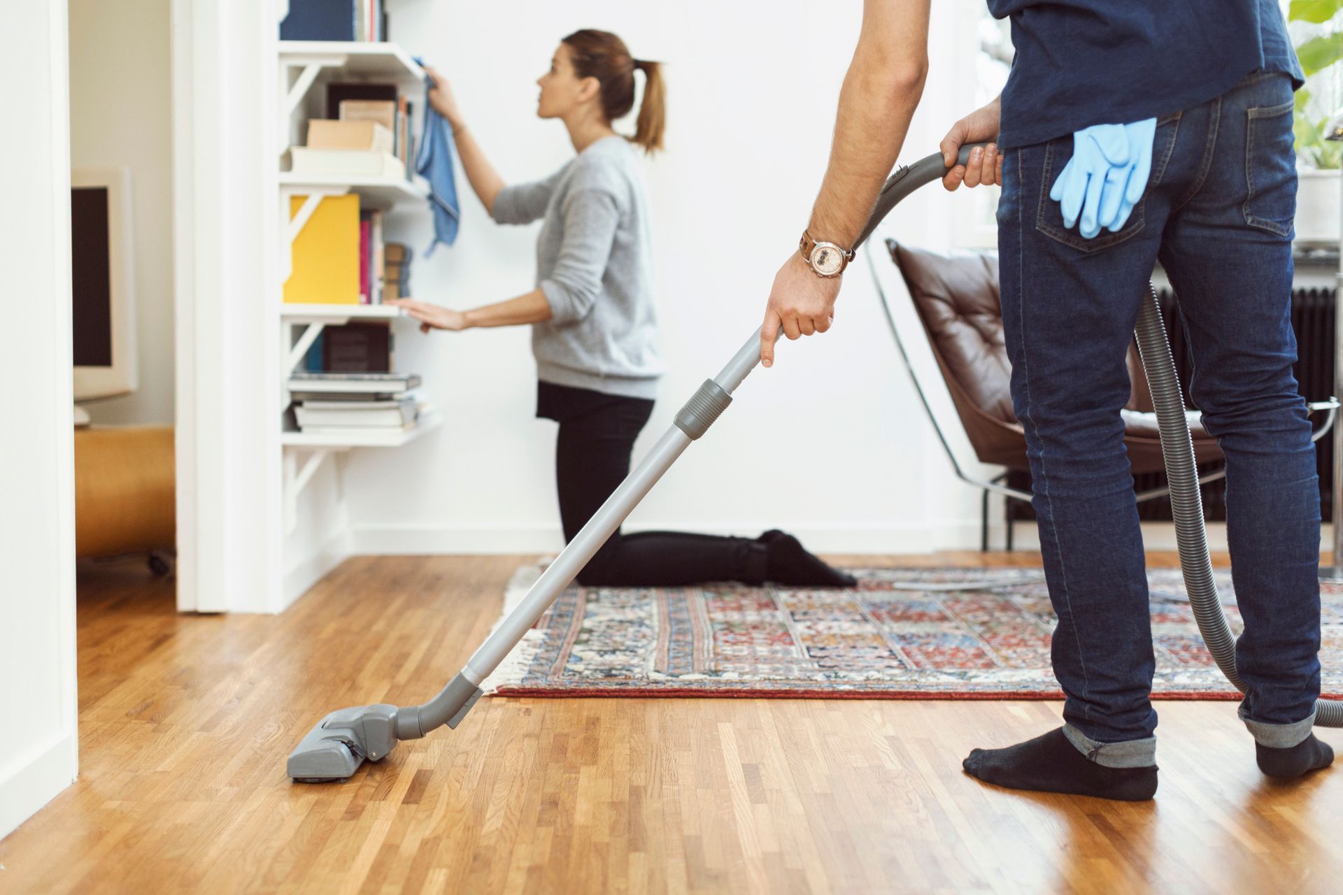 A person vacuuming the floor | House Cleaning in Lafayette Co | Clean Conscience