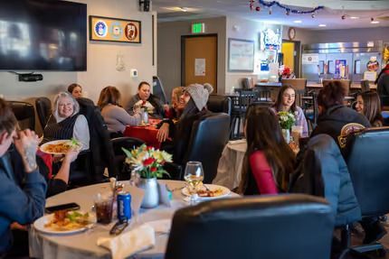 A group of people eating in a restaurant — Lafayette, CO — Clean Conscience