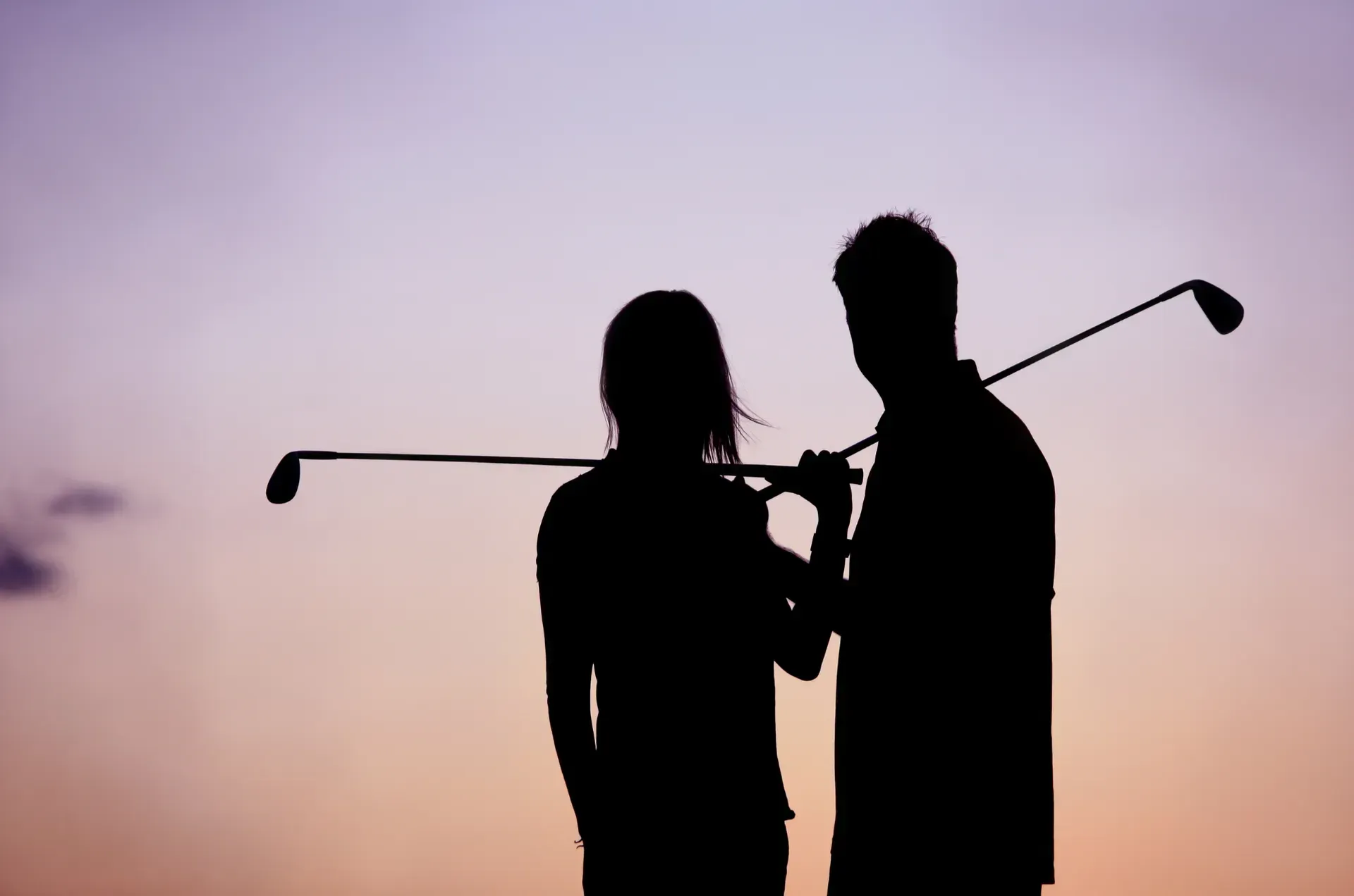 Photo of couple golfing enjoying leisure time in retirement