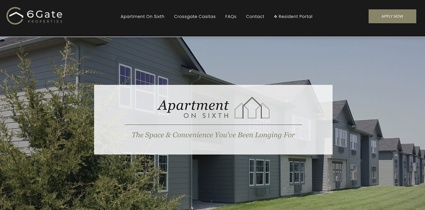 a man in red overalls is holding a cell phone in his hand .