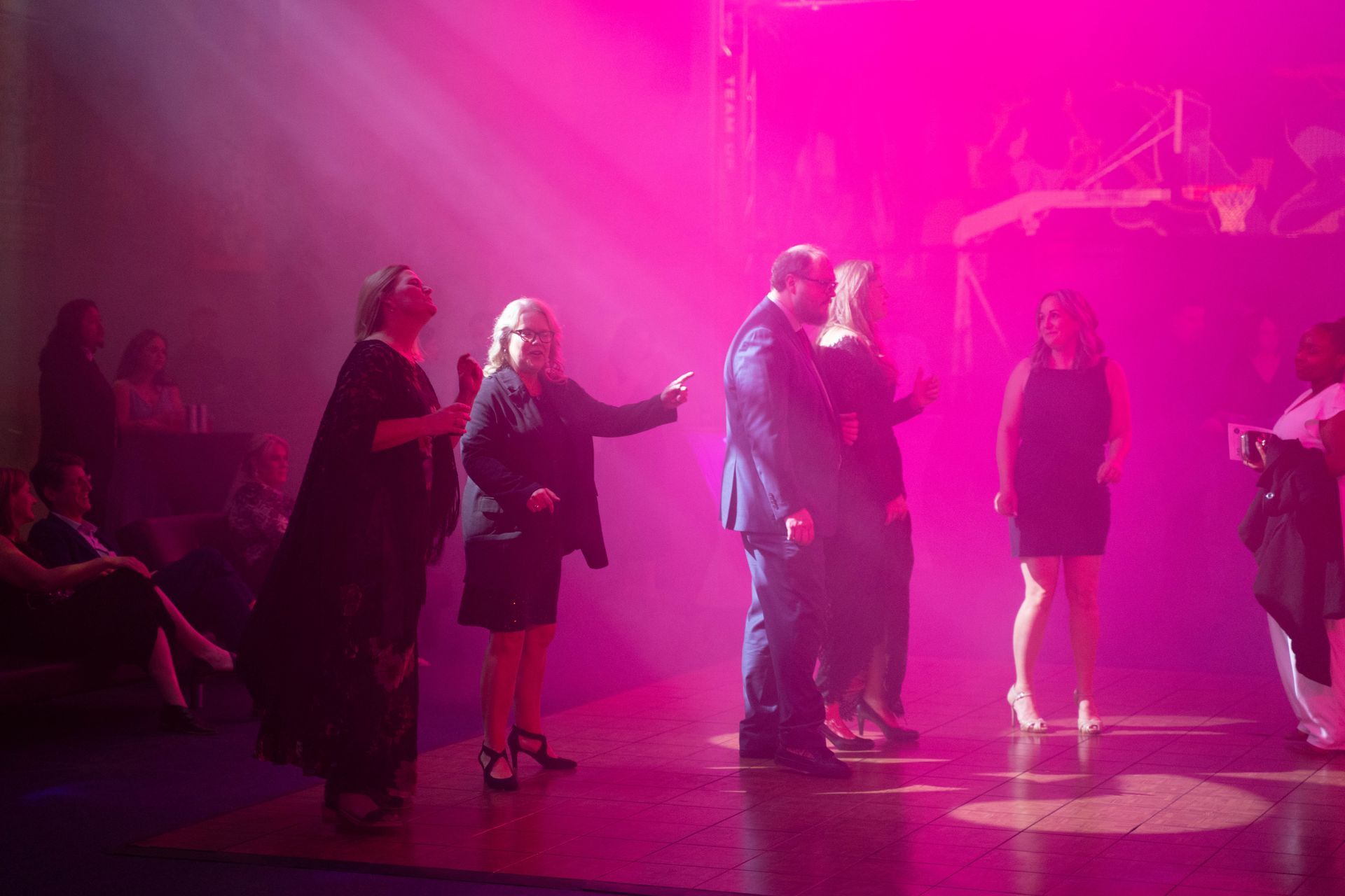 Professional photograph of a big party with a band and people are dancing.