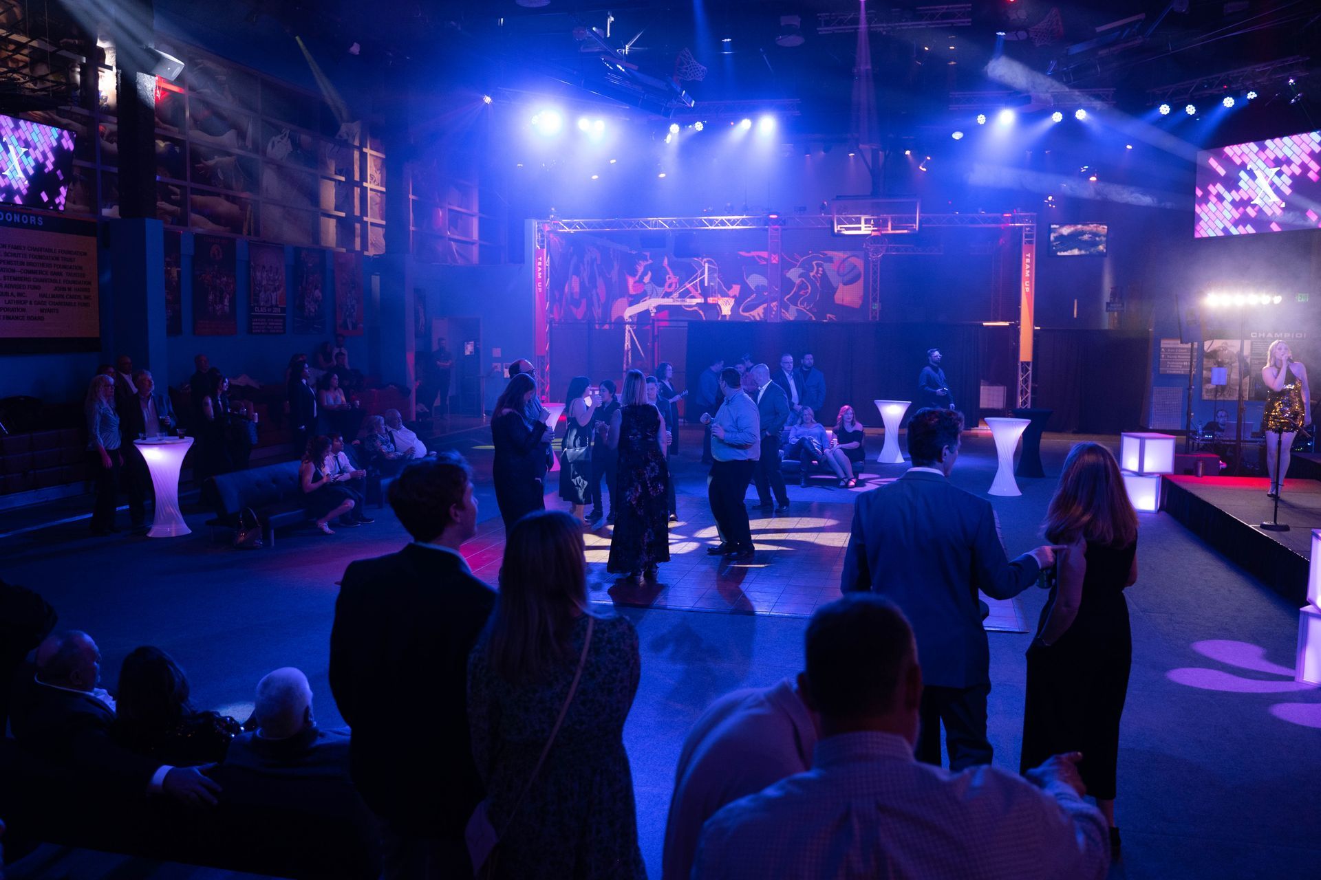 Professional photograph of a big party with a band and people are dancing.