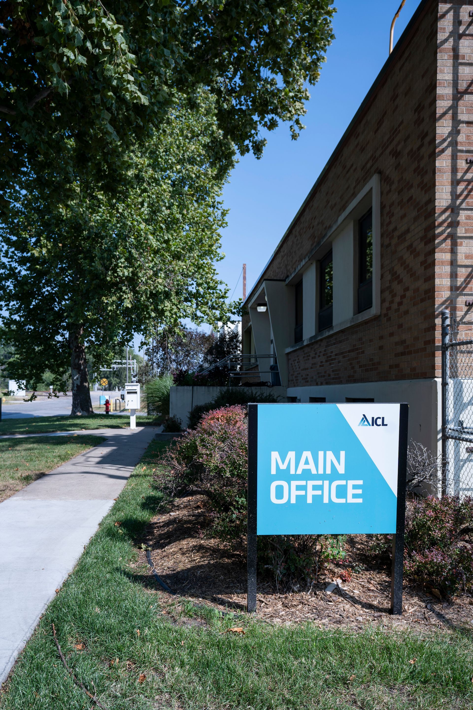 Professional photograph of an office building with a sign that says MAIN OFFICE.