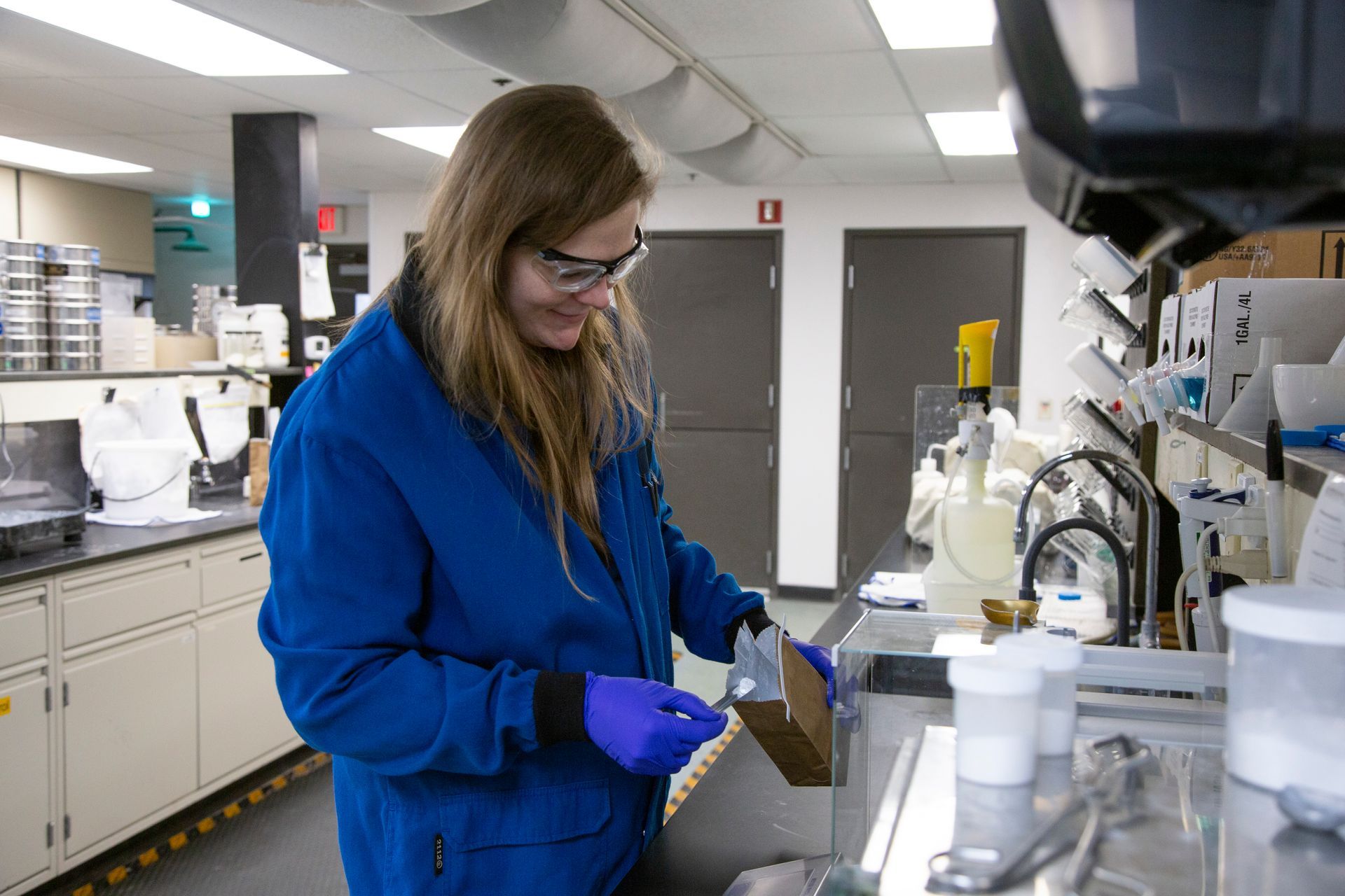 Professional photograph of a woman working in a lab.