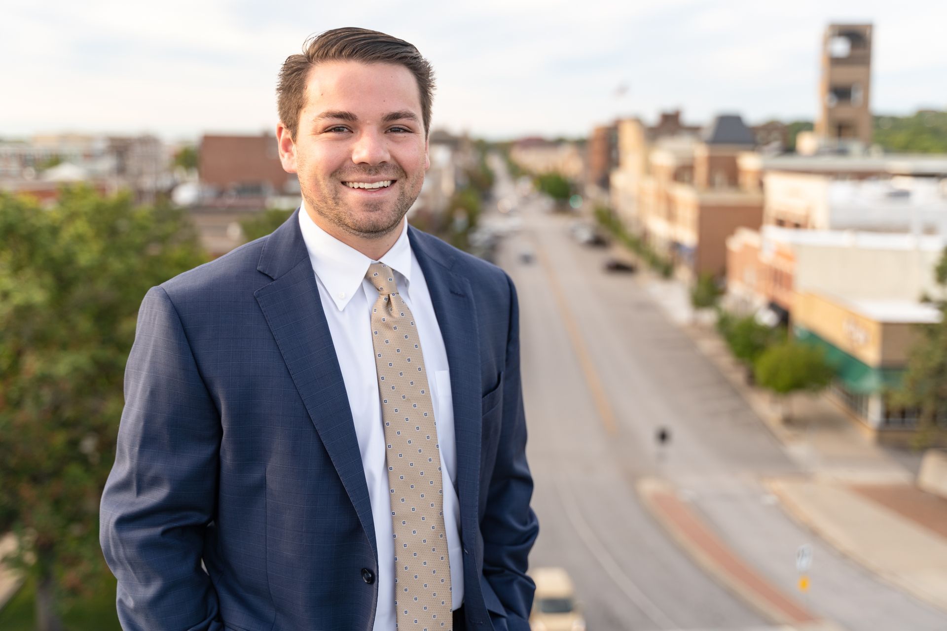 Professional photograph of a man standing on a building taken by KMG.