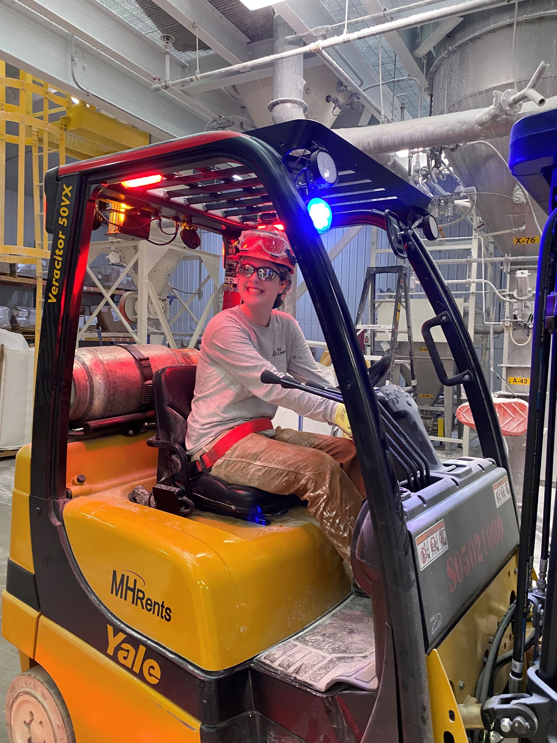 Professional advertisement of woman working in a factory that was taken by KMG.