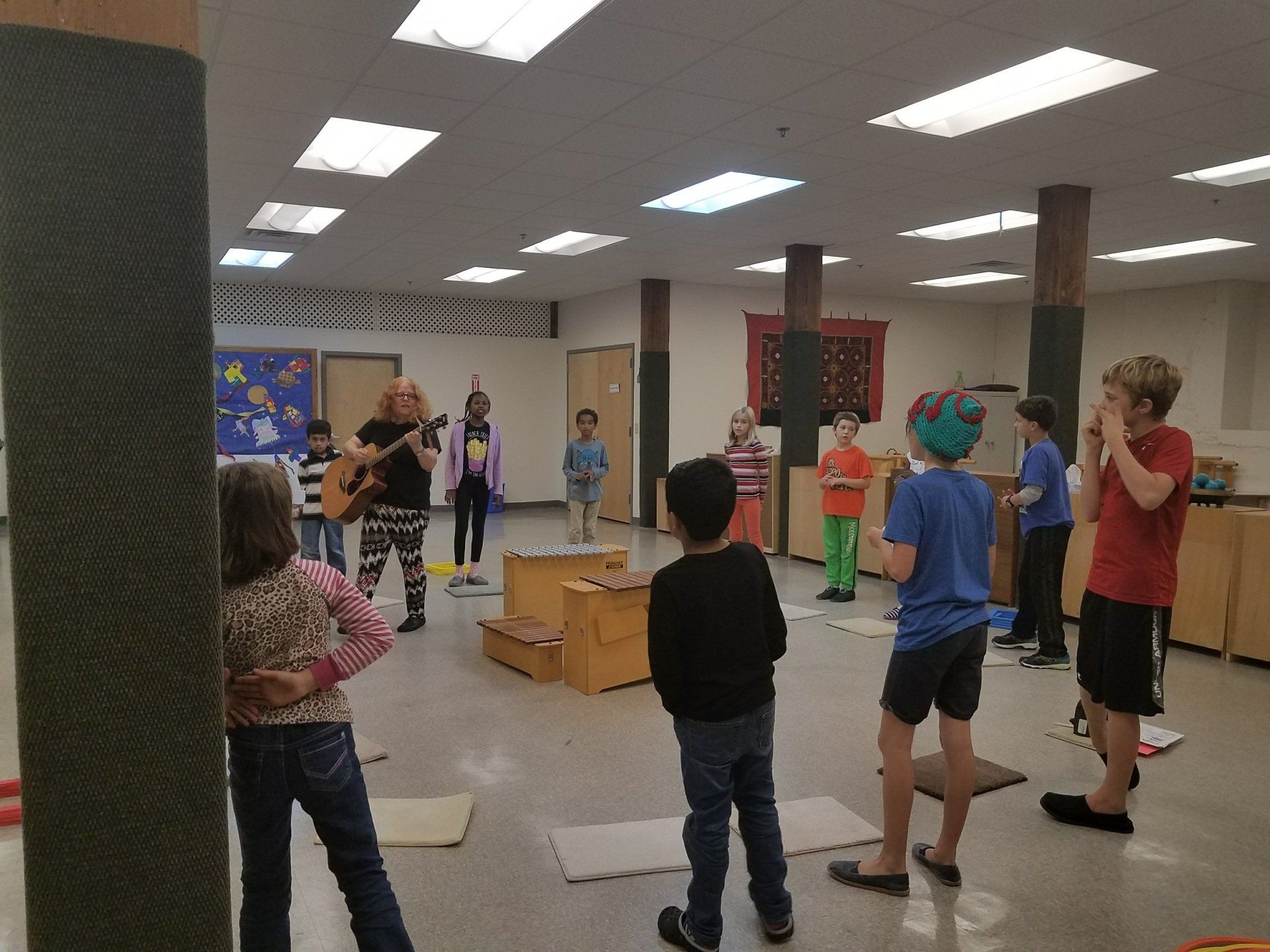 A group of children working in a Montessori classroom