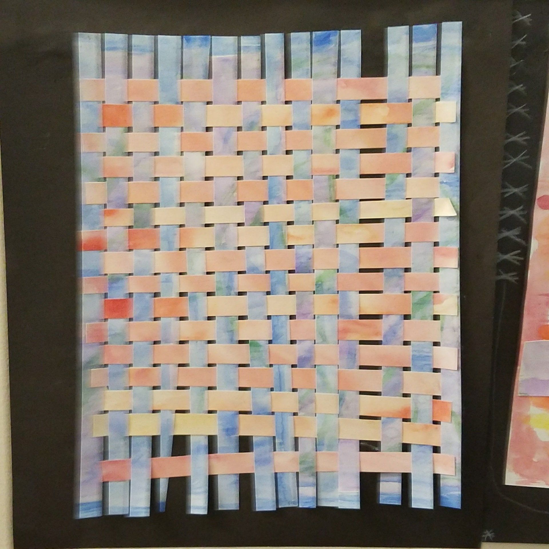 A close up of a piece of paper with a woven pattern on it.