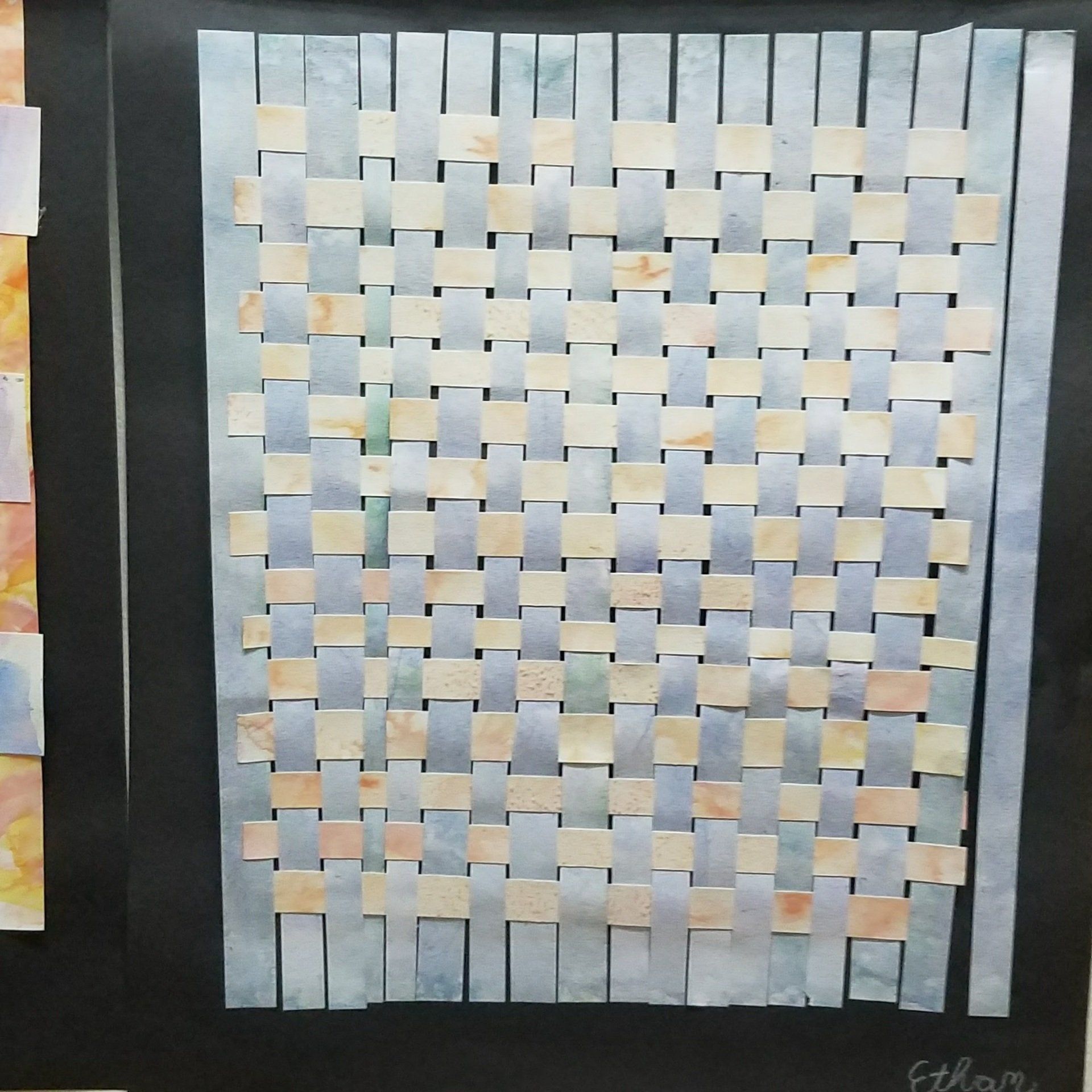 A close up of a piece of paper with a woven pattern on it.