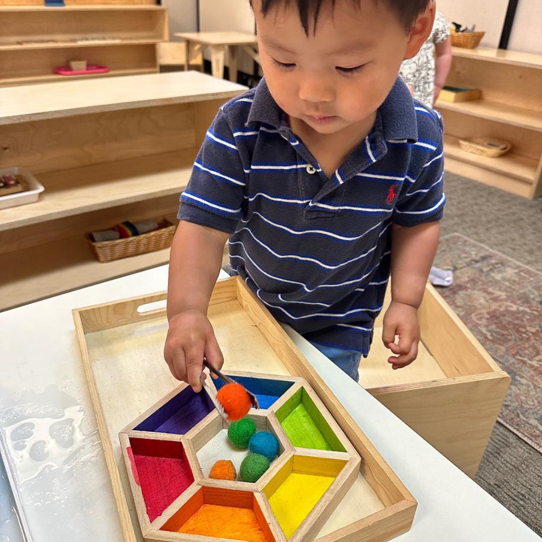 Montessori child working with math materials