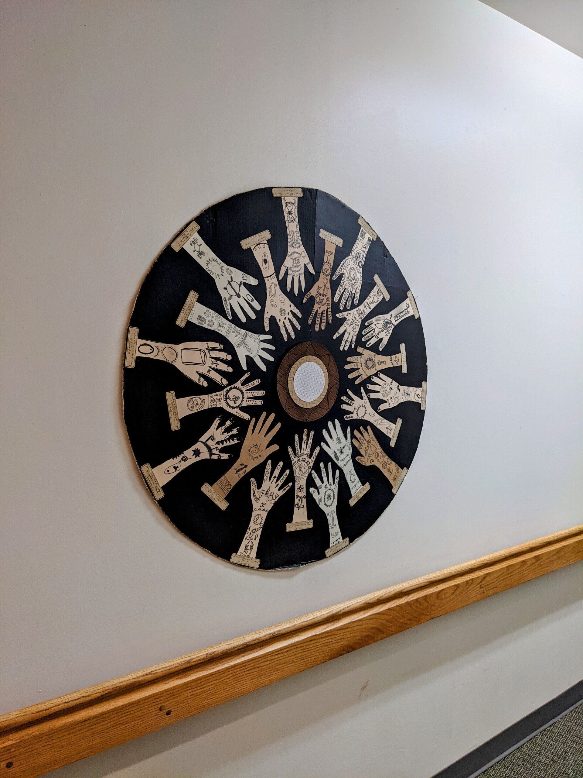 An sculture hanging on a wall