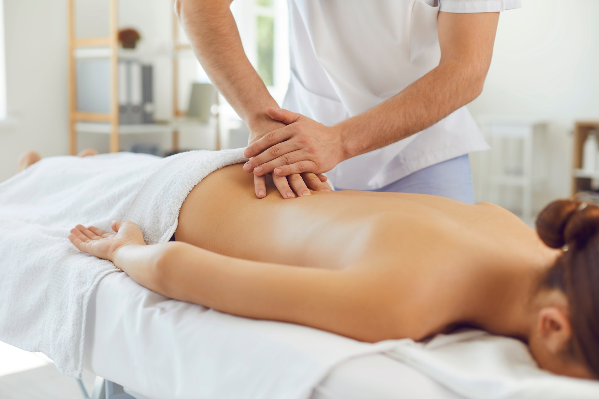 A woman is getting a massage at a spa.