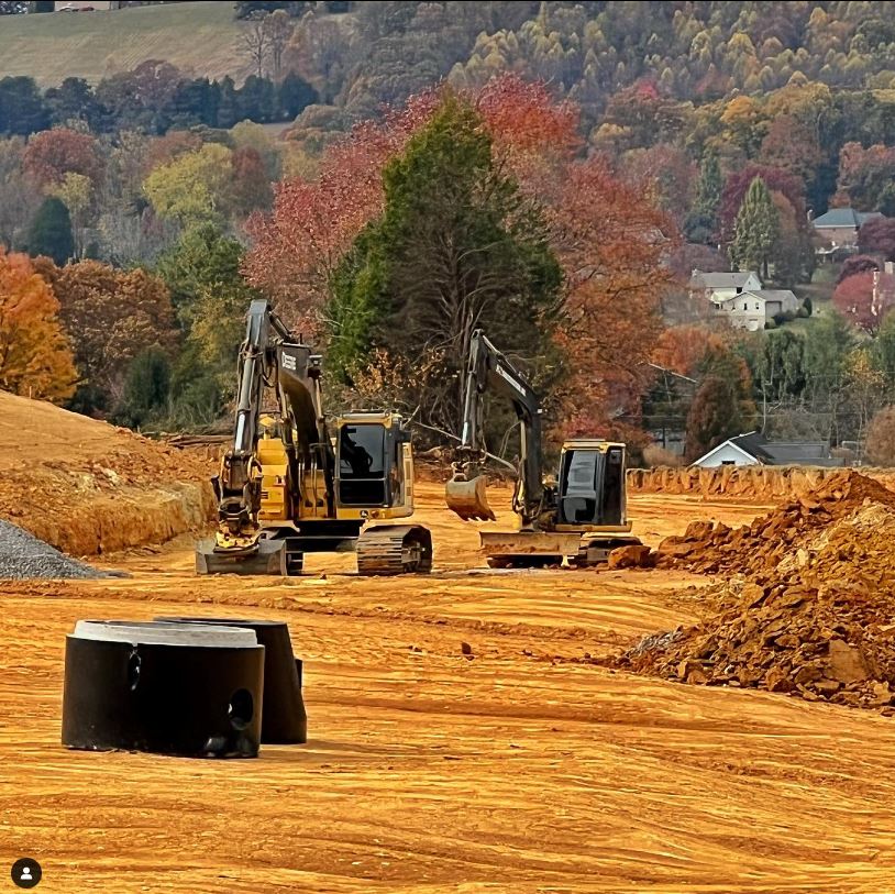 KZ Construction Excavators on a job site grading and excavating