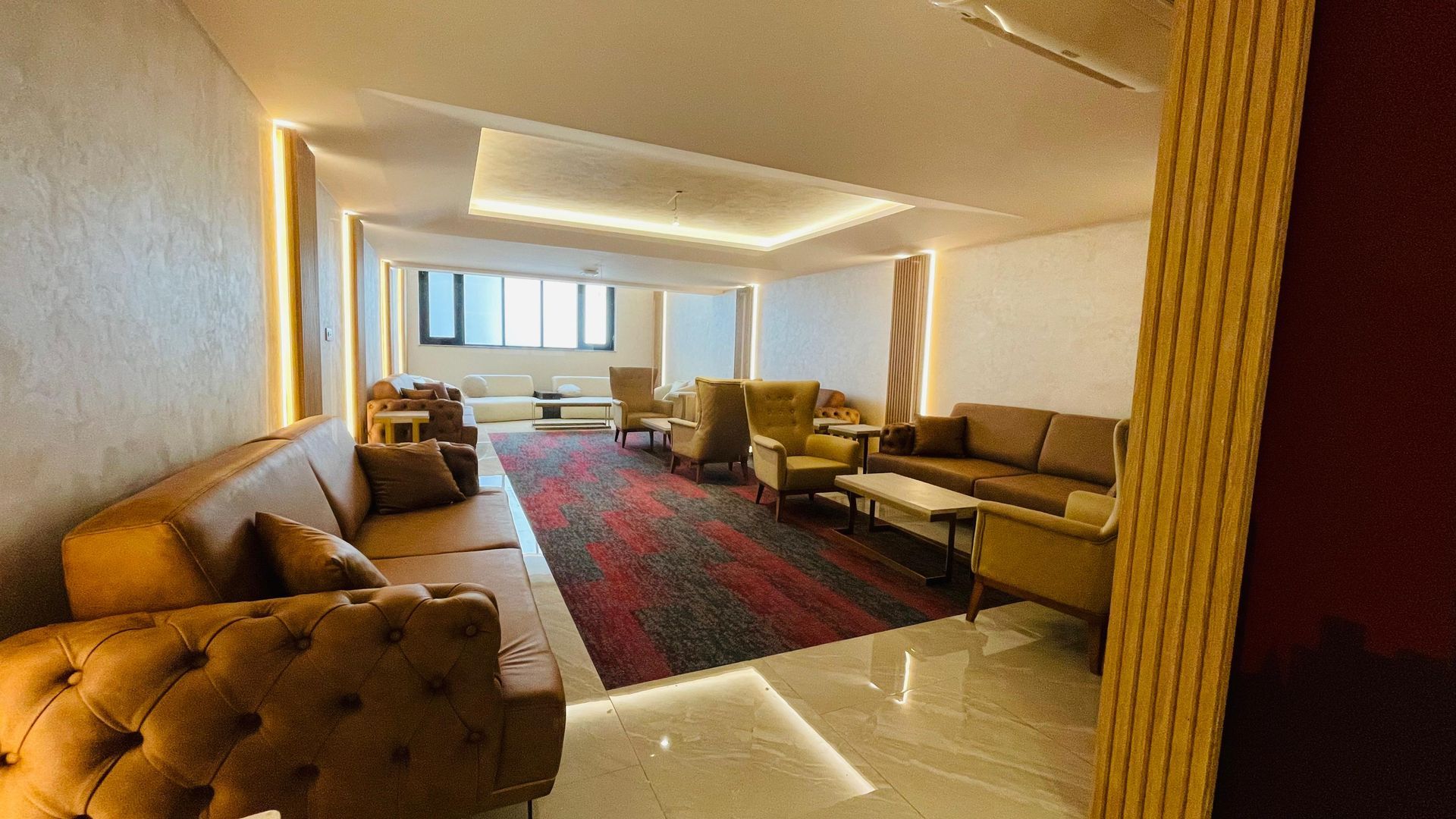 A living room filled with furniture and a couch.