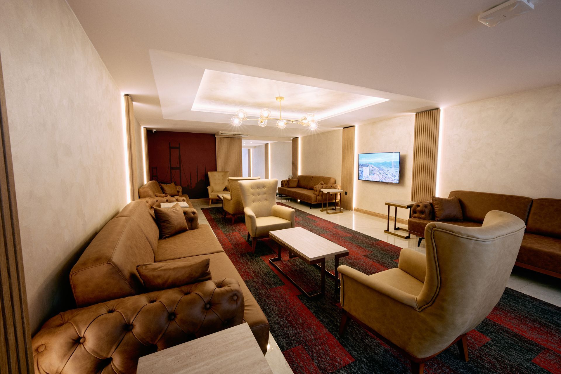 A living room filled with furniture and a television.