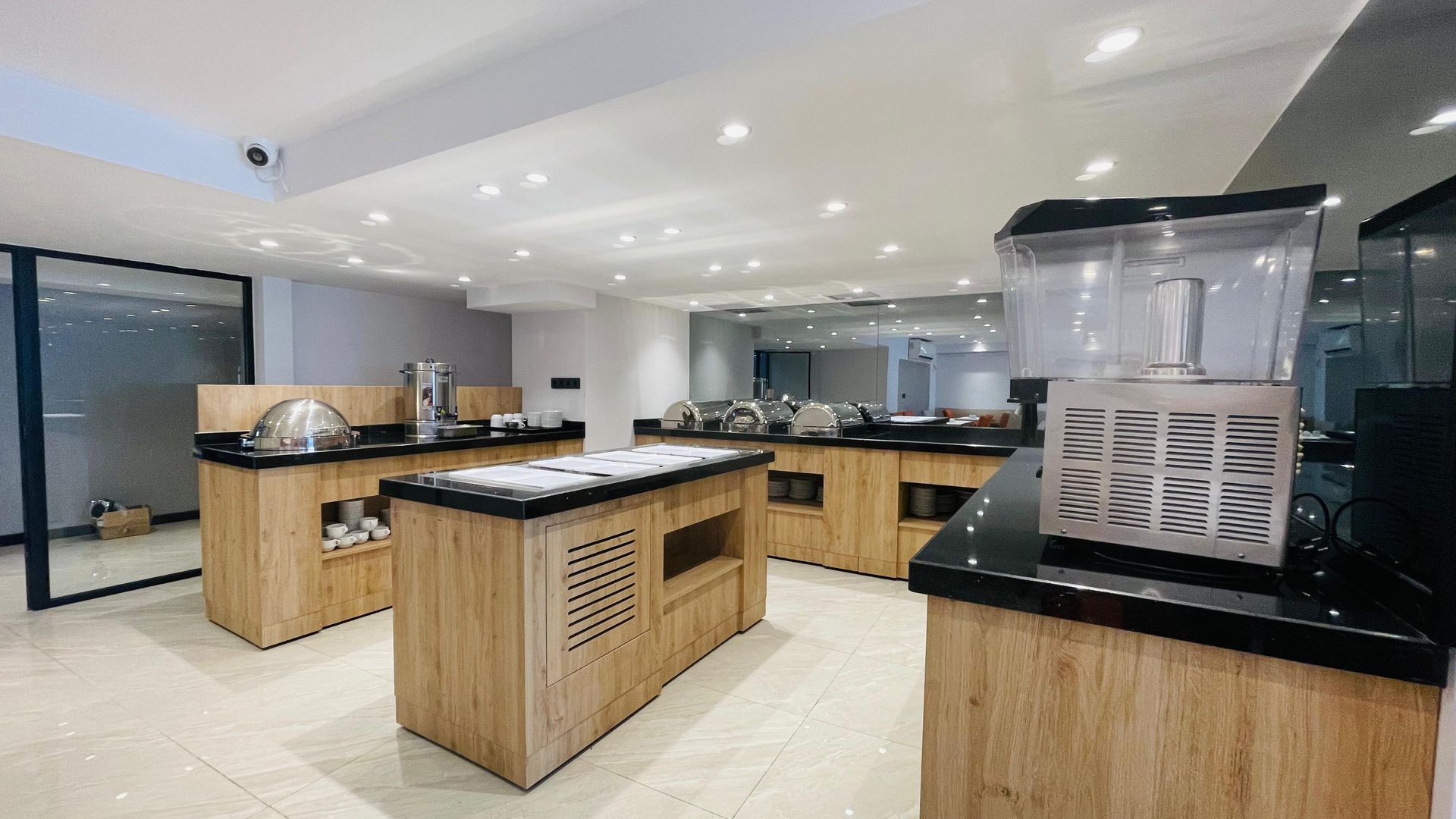 A kitchen with a lot of wooden cabinets and appliances.