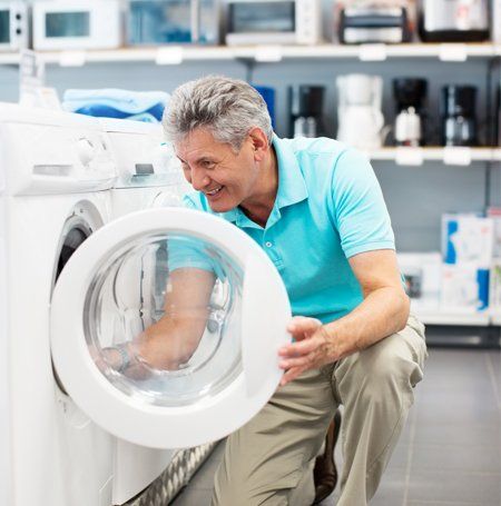 Senior Man Looking for Washing Machine — Canberra, ACT — Renewed Appliances - Manhos