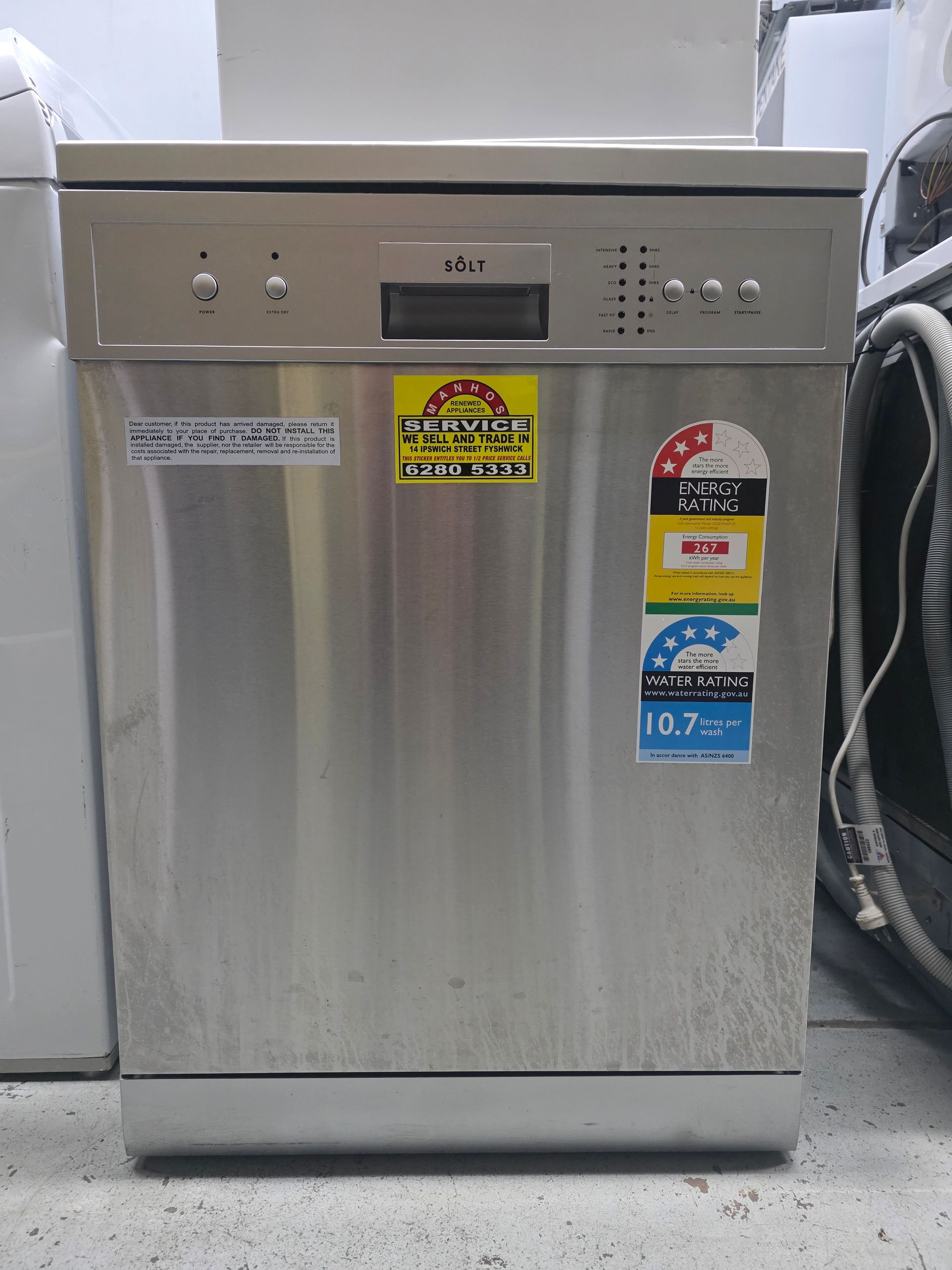 Stainless steel dishwasher with energy efficiency stickers.