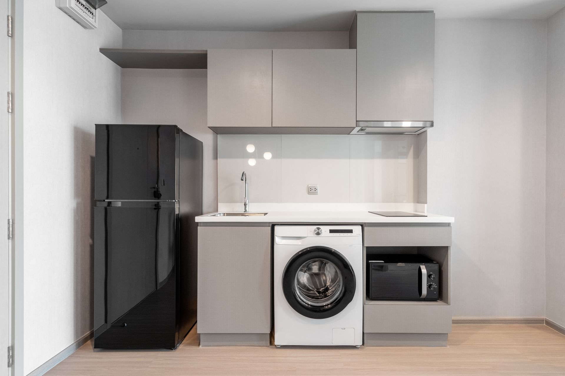 Compact modern kitchen design featuring smart countertop use for innovative house designs.