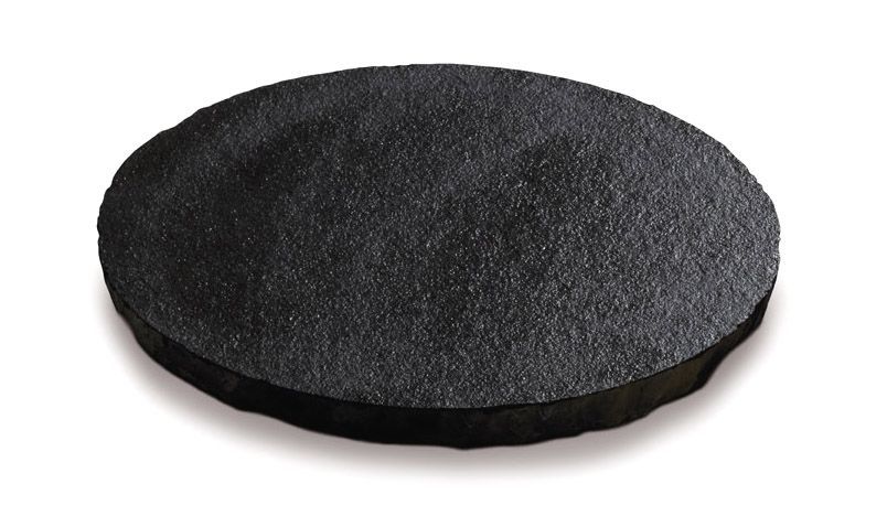 Cuscinetto antiscivolo rotondo, nero, con superficie testurizzata, adatto anche per l'uso sul pavimento.