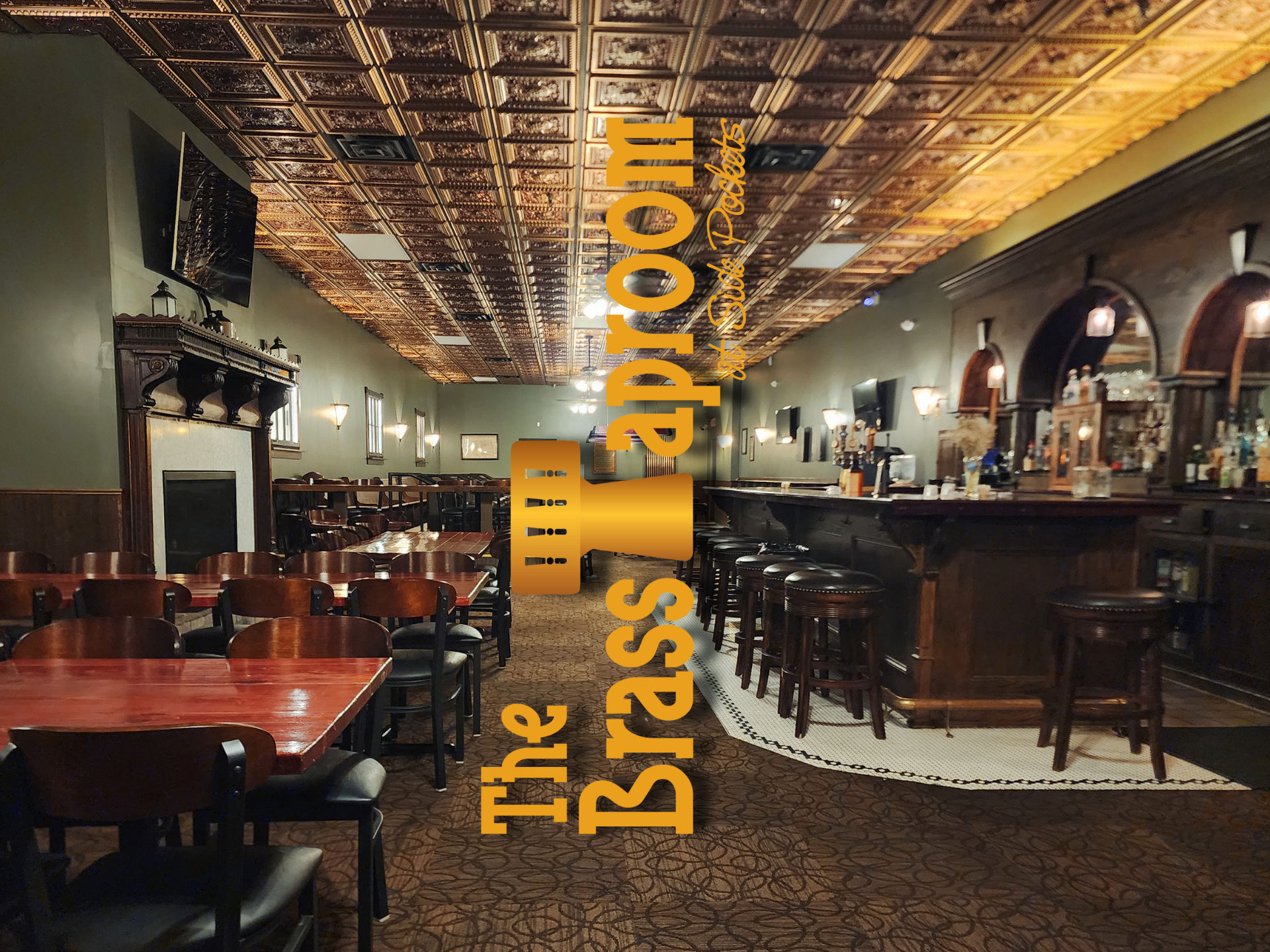Click to go to The Brass Taproom Interior of The Brass Taproom, bar with tables and a copper-tiled ceiling.