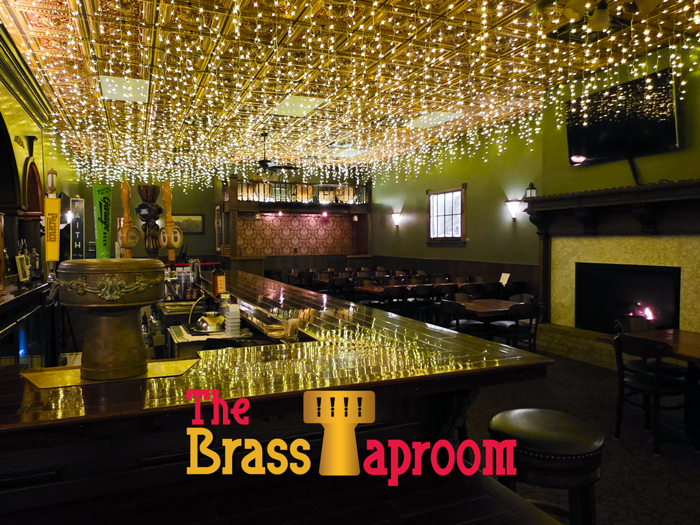 Interior of The Brass Taproom, bar with tables and a copper-tiled ceiling.