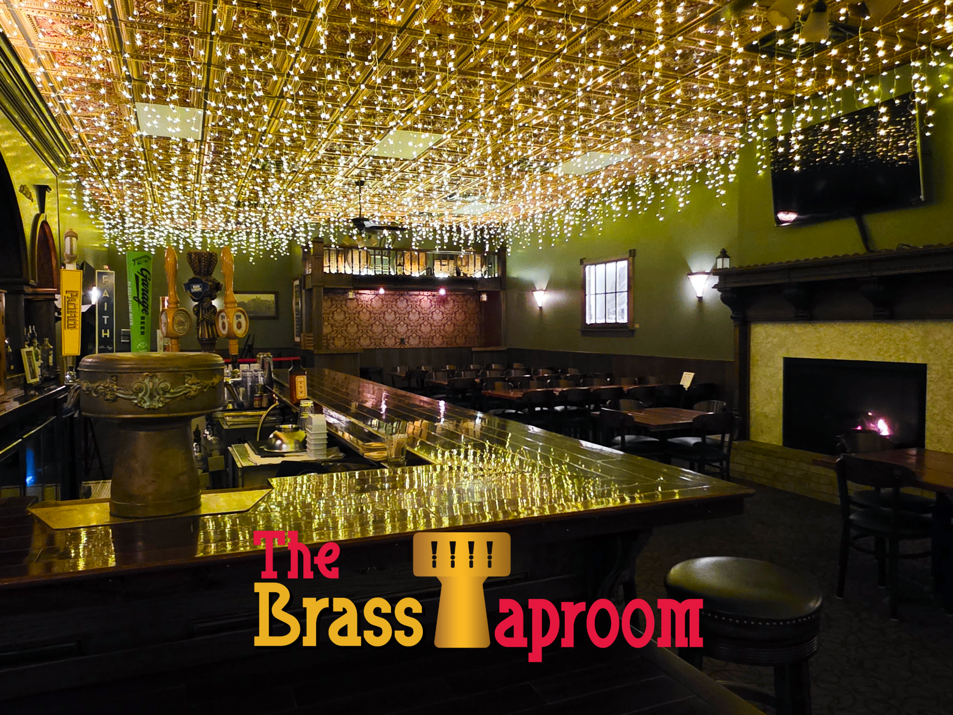 Interior of The Brass Taproom, bar with tables and a copper-tiled ceiling.