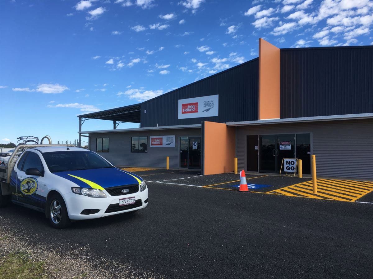 Store With Yellow Carpark Lines — Sign Writing in Dubbo, NSW