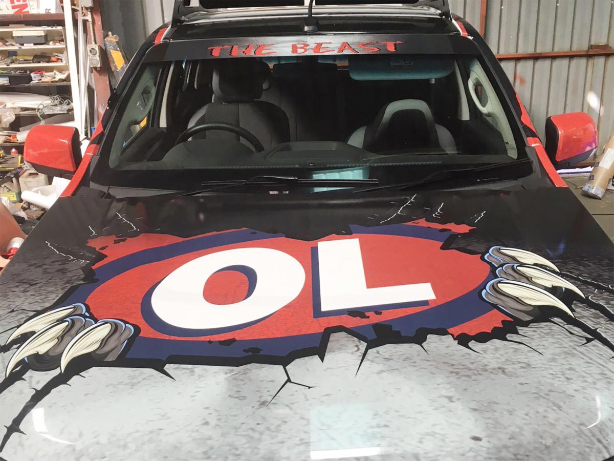 Car With OL Sign Design — Sign Writing in Dubbo, NSW