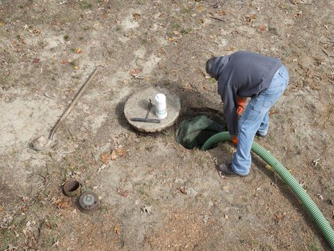 Man Opening A Septic Tank — Mission, TX — Always Here Septic, Ltd.