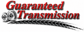 Guaranteed Transmission logo with red text, gears, and a black tire track