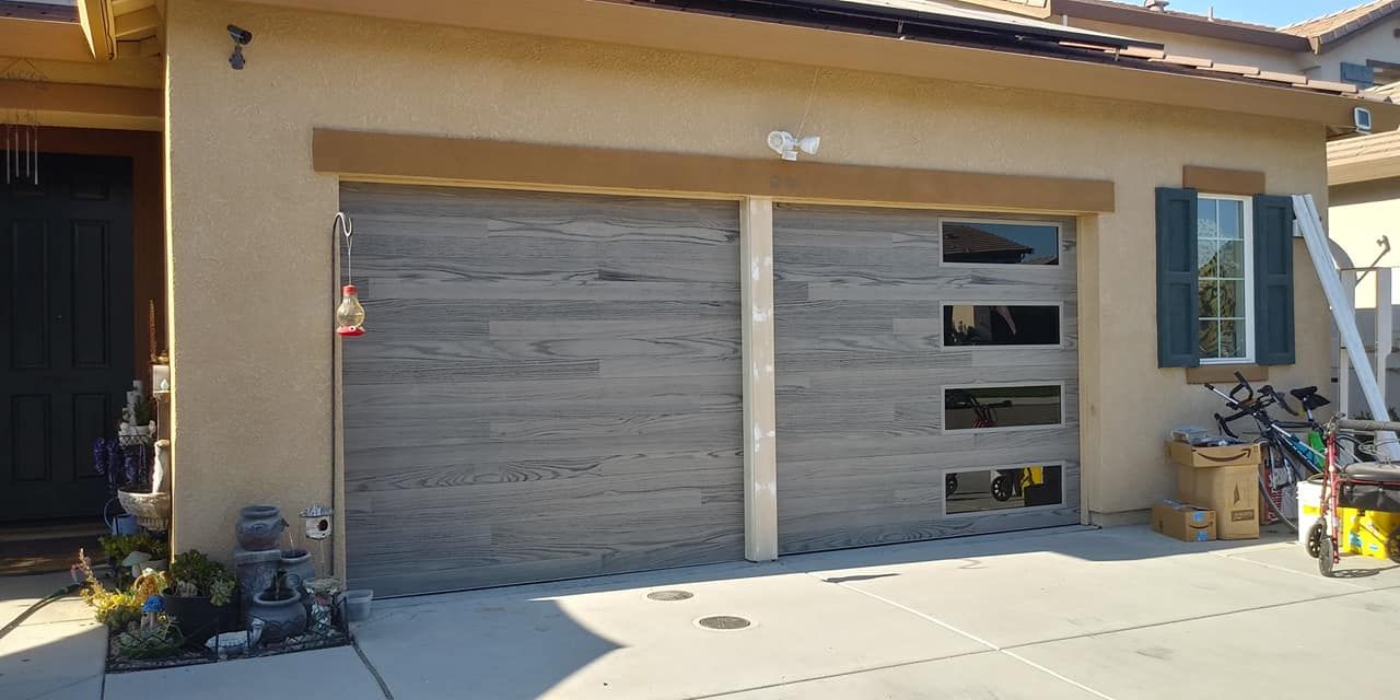 A house with a garage door that looks like wood.