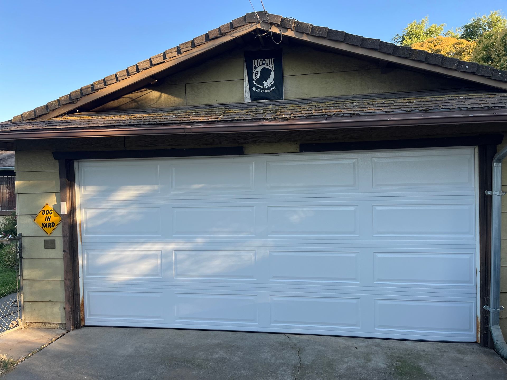 A white garage door with the number 13 on it
