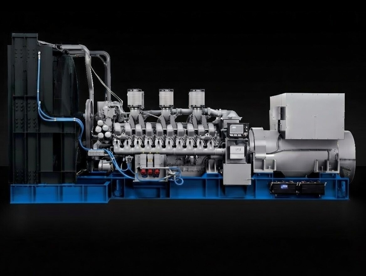 Large industrial generator on a blue base, with various pipes and machinery against a black background.