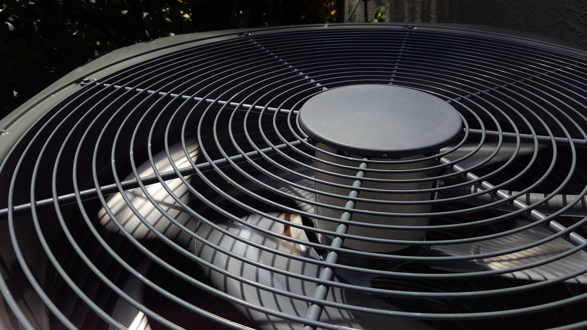 A close up of a fan with a circular design
