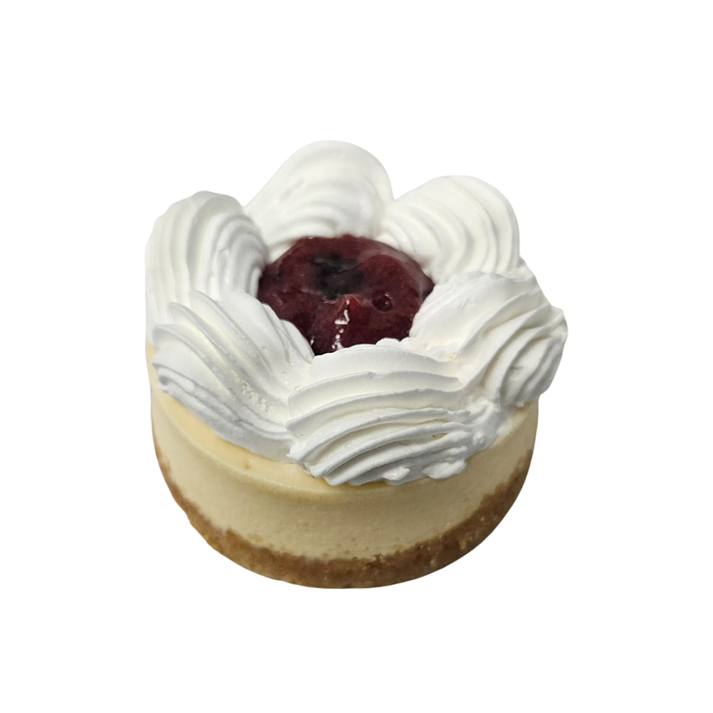 Mini tarta de queso con remolinos de crema batida y cobertura de cerezas  de Azúcar y Cacao