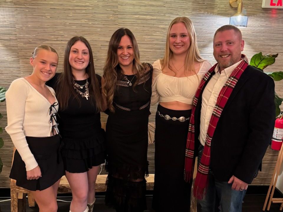 A group of people are posing for a picture together.