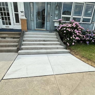 A concrete walkway with concrete stairs