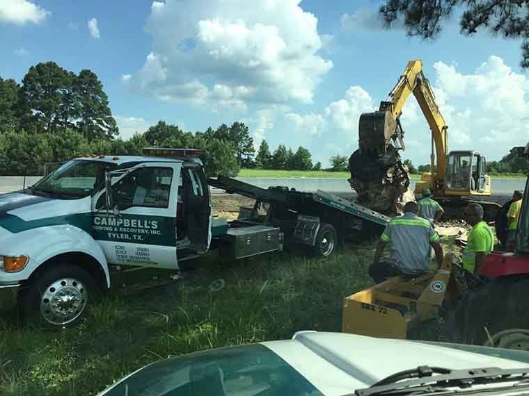 Heavy-duty tow truck with construction equipment