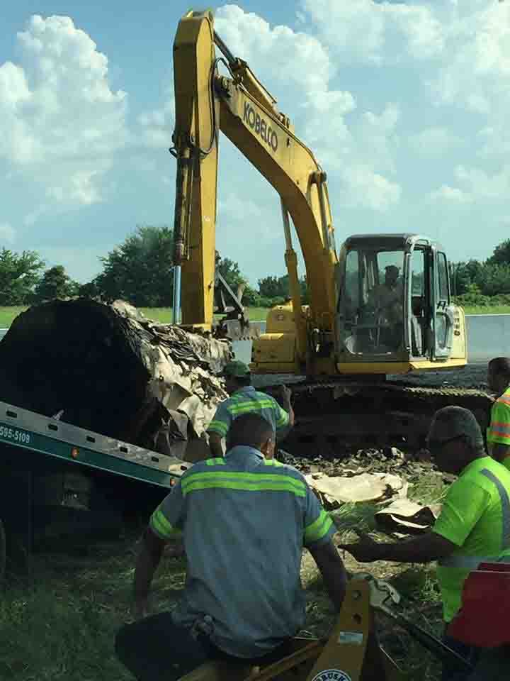 Heavy equipment on tow truck