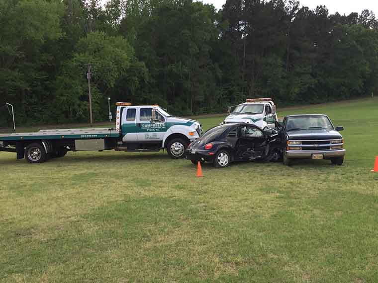 Tow truck and Volkswagen at accident site