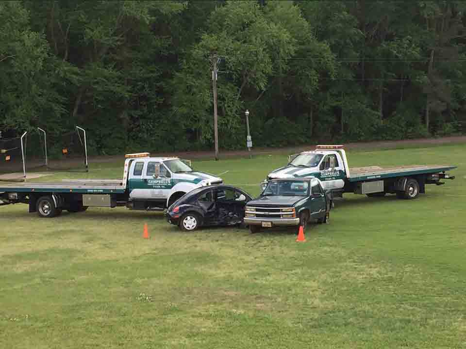 Tow trucks, pickup truck and Volkswagen Beetle
