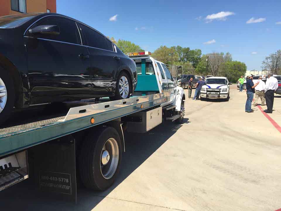 Car on flatbed truck