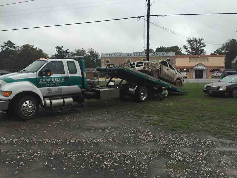Demolished car on tow truck